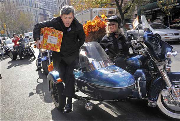Winemaker Franck Duboeuf arrives in a motorcycle sidecar as he delivers the first case of Georges Duboeuf 2008 Beaujolais Nouveau.